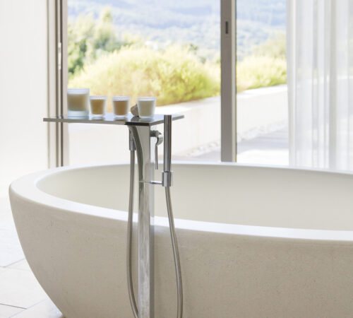 Candles near bathtub in modern bathroom Candles near bathtub in modern bathroom